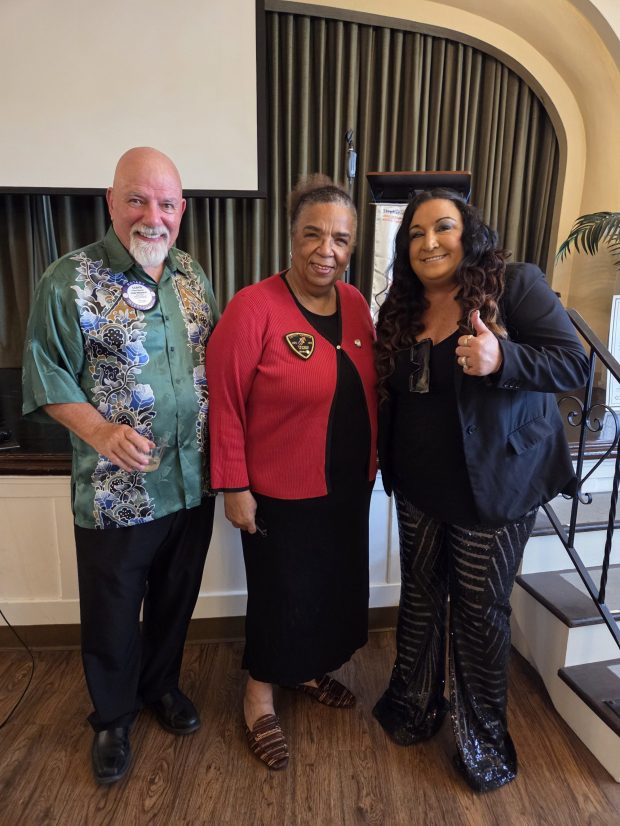 Rotary District 5340 Governor Diane Crawford (center) joins Point Loma Rotarians Lloyd Weaver and Margaret Virissimo in celebrating the Point Loma club's 75th anniversary. (Provided by Margaret Virissimo) 