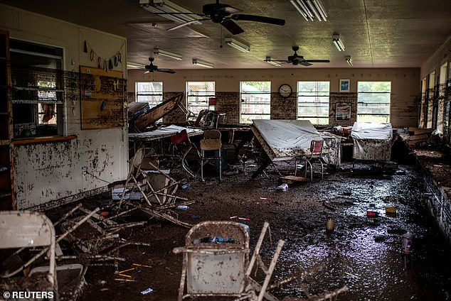Windows in the cabins were shattered and the interiors were completely covered in mud