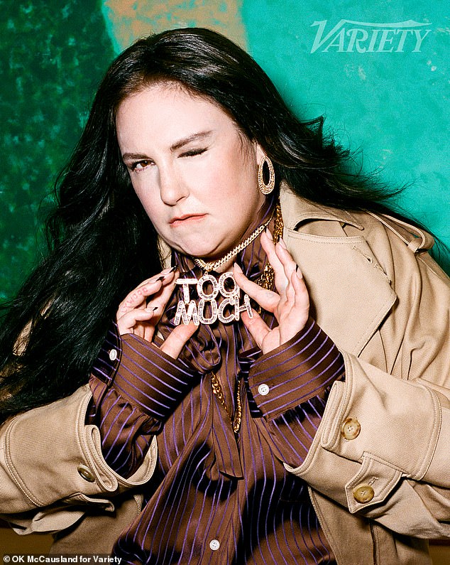 Dunham posed wearing a 'Too Much' necklace in a nod to her latest show
