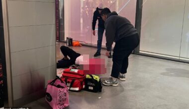 A witness shared a photo of paramedics treating the man as he lay on the ground (pictured)