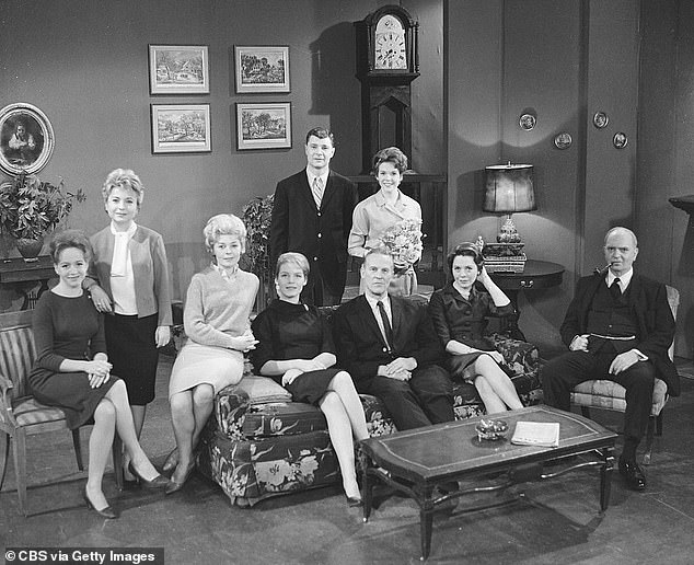 Fulton is pictured in character as LIsa, standing behind the central sofa, in a cast photo for the long-running CBS soap opera taken in 1962