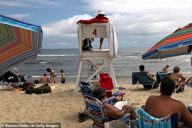 Contender is the largest shark ever tracked in the Atlantic. Pictured: Lifeguard Seamus Roche on Coast Guard Beach keeps a lookout
