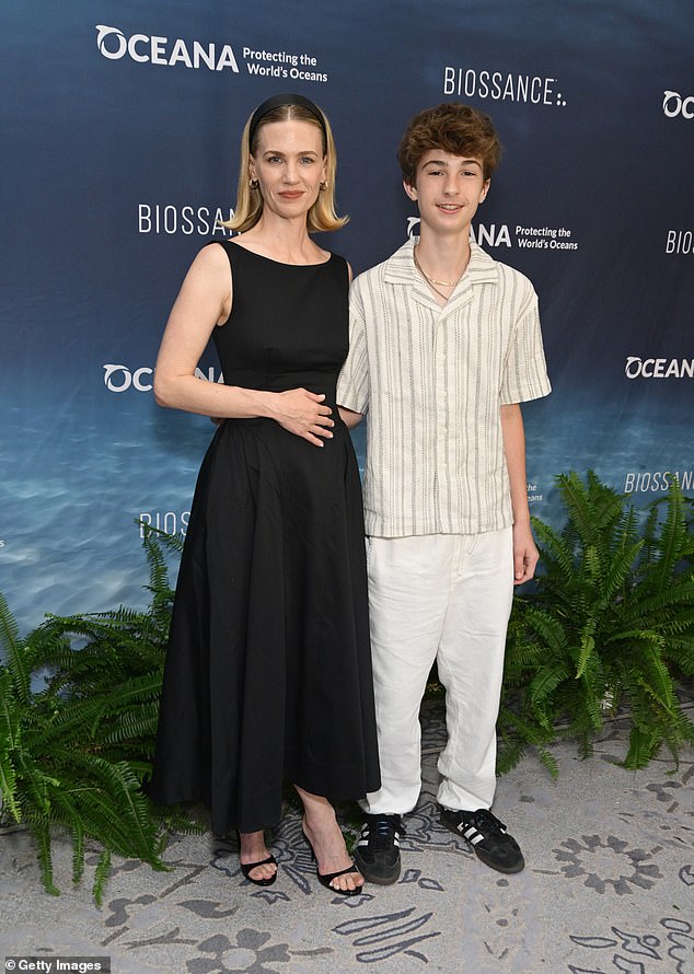 Xander wore a summery ensemble of an off-white button-down top with off white pants and black Adidas sneakers