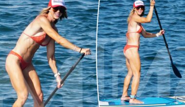 Bikini-clad Lara Trump shows off her toned body while paddleboarding with husband Eric