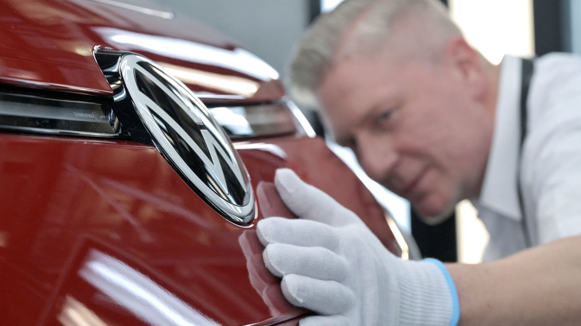 A technician works in the final inspection line of German carmaker Volkswagen's electric ID.3 car, during a media tour, in Dresden, Germany, May 14, 2025.