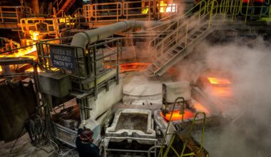 Mining firms power UK stocks to record high
