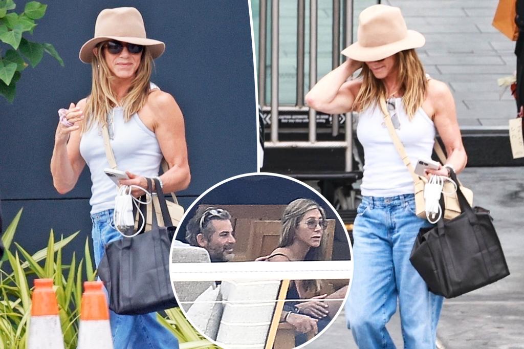 Jennifer Aniston all smiles after Mallorca vacation with Jim Curtis