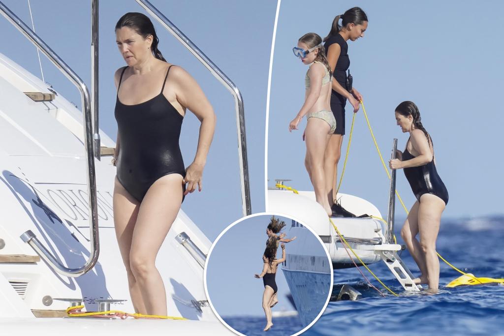 Drew Barrymore takes a dip in black swimsuit on yacht in St. Tropez