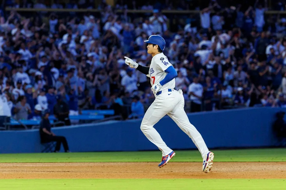 Shohei Ohtani runs the bases after hitting his 30th homer of the season.
