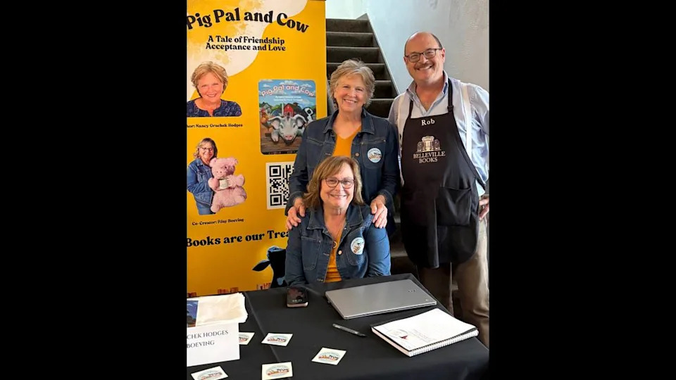 “Pig Pal and Cow” co-authors Nancy Grachek Hodges and PJay Boeving (seated) with Belleville Books owner Rob Eckman