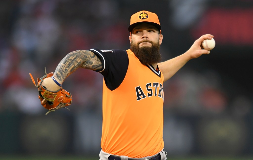 Baseball player pitching a ball.