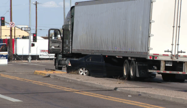 Phoenix driver becomes stuck under semi-truck