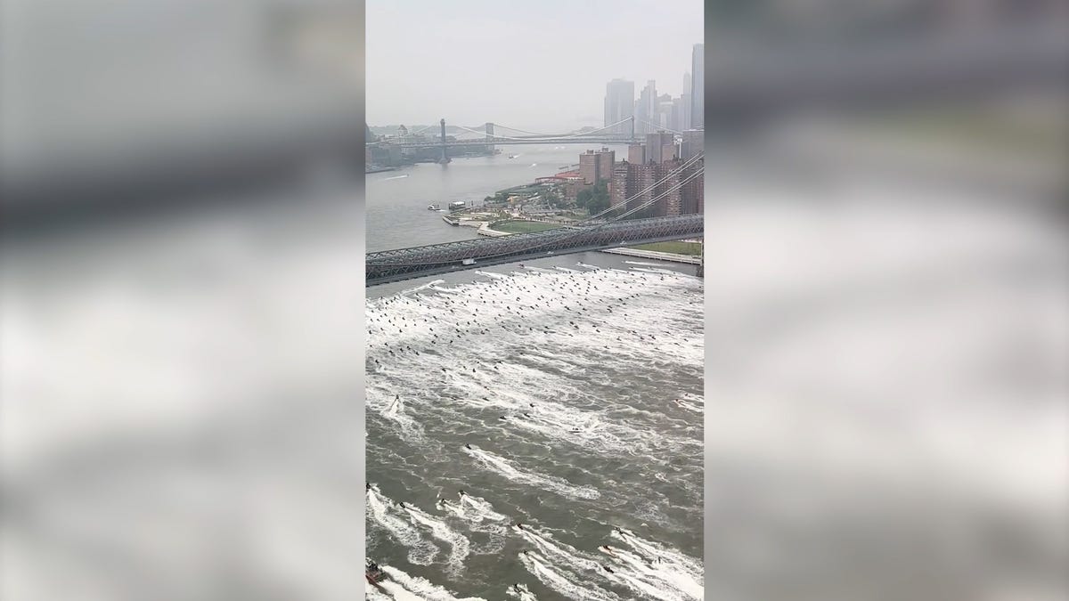 Hundreds ride across NYC river in jet ski invasion
