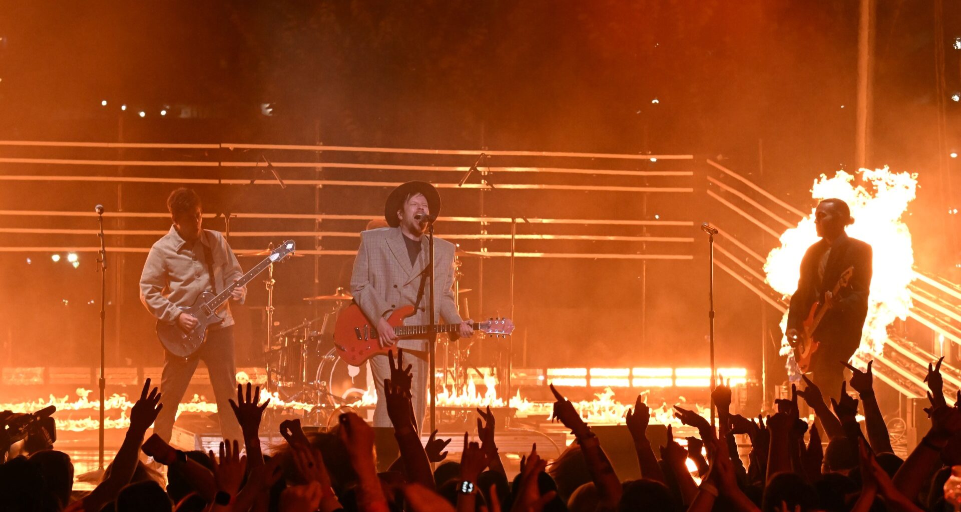 US rock star drops out of huge band's gigs for the rest of the year to have surgery to stop 'permanent damage'