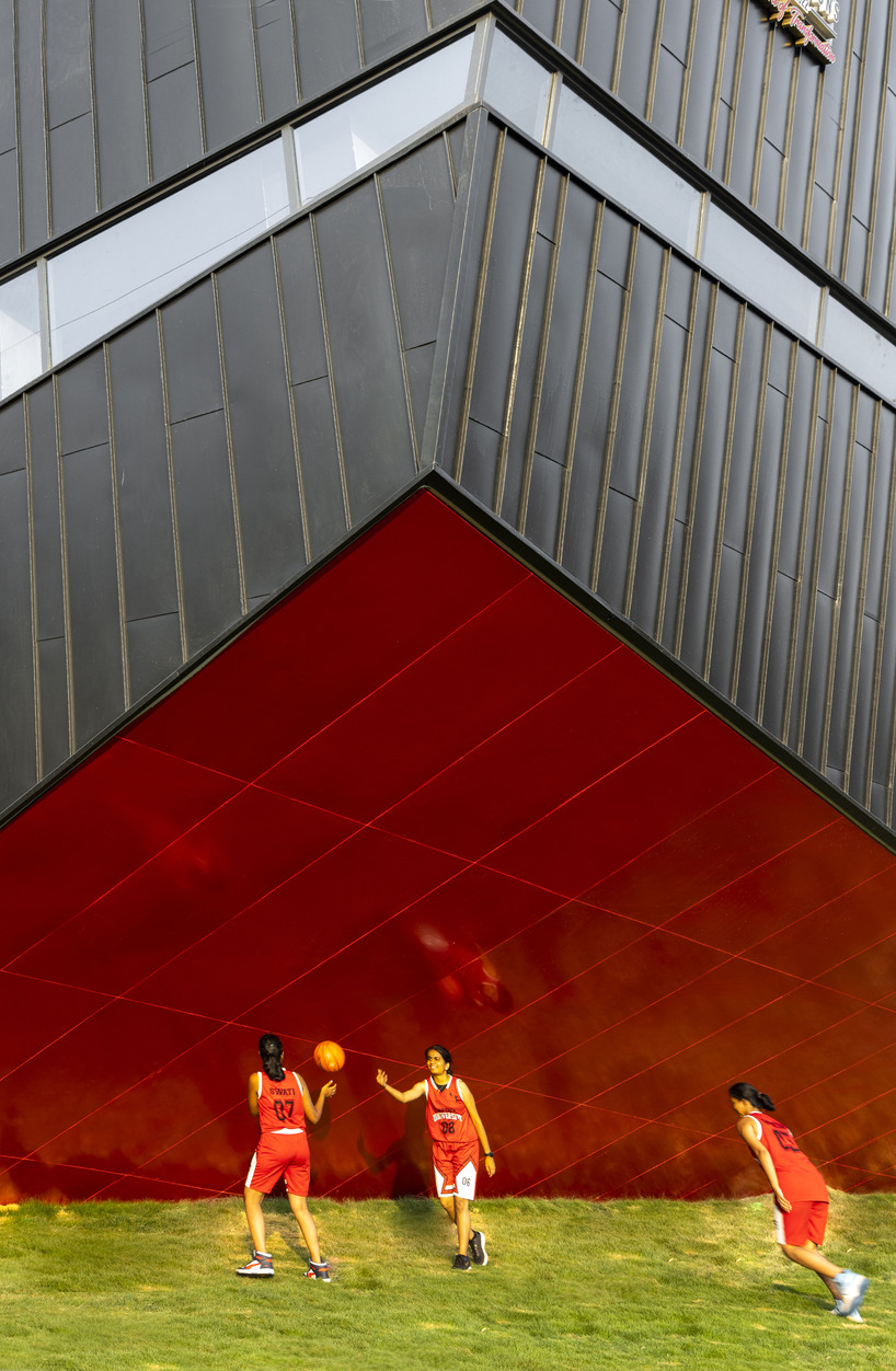 this sports arena is both ground and sky a structure that disappears into landscape yet commands the citys attention boldly 3