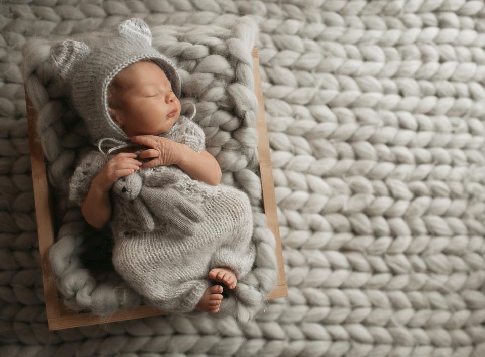 tiny-baby-grey-clothes-sleeps-woolen-blanket