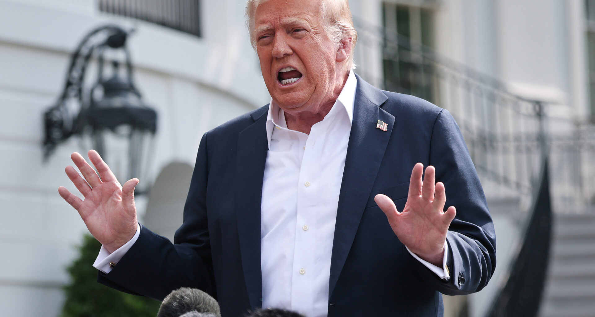 President Donald Trump answers questions