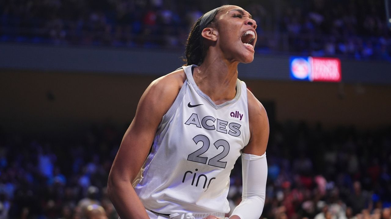 A'ja Wilson scores a season-high 37 and Las Vegas holds off a late rally to beat the Wings 90-86