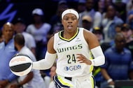 Dallas Wings guard Arike Ogunbowale (24) dribbles the ball up court during the second half...