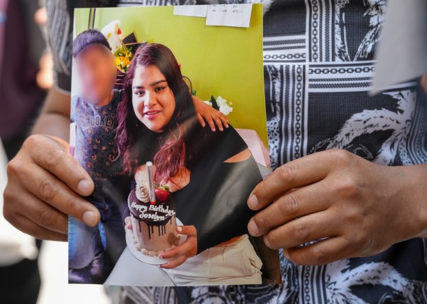 An Ecuadorian immigrant, Maria Chipantiza, holds a photo of her daughter, Jocelyn Chipantiza, 20, who was taken into Federal custody last week outside Jacob K. Javits Federal Building Thursday, July 3, 2025 in Manhattan, New York. (Barry Williams/ New York Daily News)