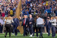 People cheer and boo, as President Donald Trump, next to FIFA President Gianni Infantino,...