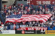 FC Dallas fans unfurl a United States flag during the national anthem as FC Dallas hosts...