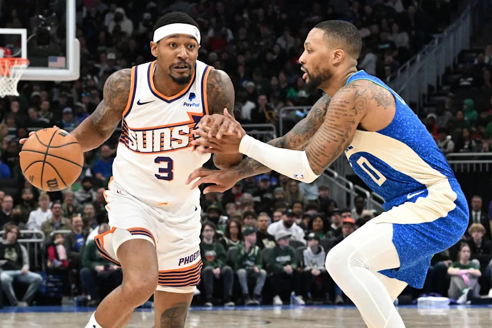 Phoenix Suns guard Bradley Beal drives against Milwaukee Bucks guard Damian Lillard.Michael McLoone-Imagn Images