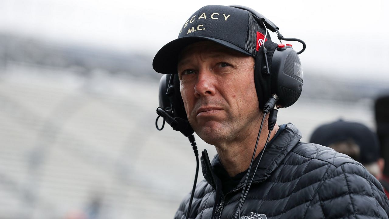 NASCAR Cup Series driver Jimmie Johnson (left) talks with crew chief Todd Gordon in the garage during testing at Phoenix Raceway.