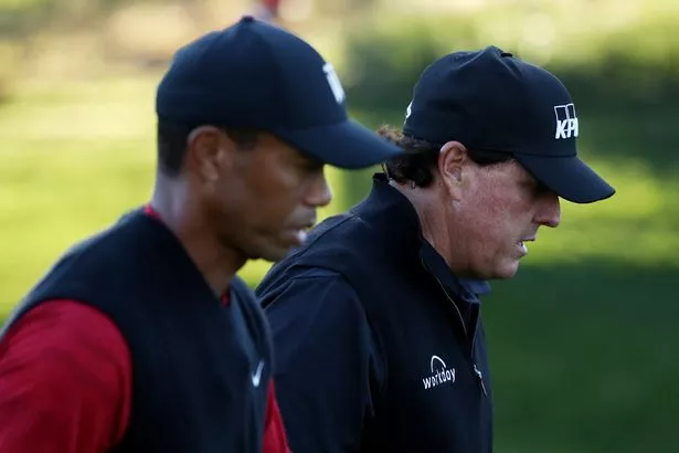 LAS VEGAS, NV - NOVEMBER 23:  Tiger Woods and Phil Mickelson walk during The Match: Tiger vs Phil at Shadow Creek Golf Course on November 23, 2018 in Las Vegas, Nevada.  (Photo by Christian Petersen/Getty Images for The Match)