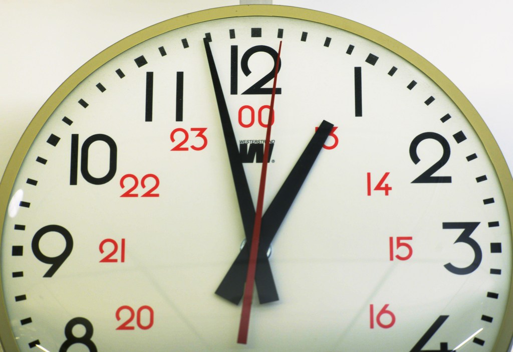 Clock showing 11:59:59, about to add a leap second.