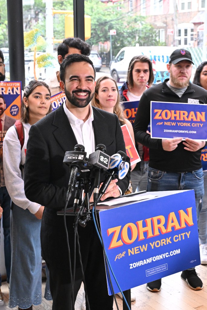 Zohran Mamdani, NYC mayoral candidate, at a press conference with supporters.