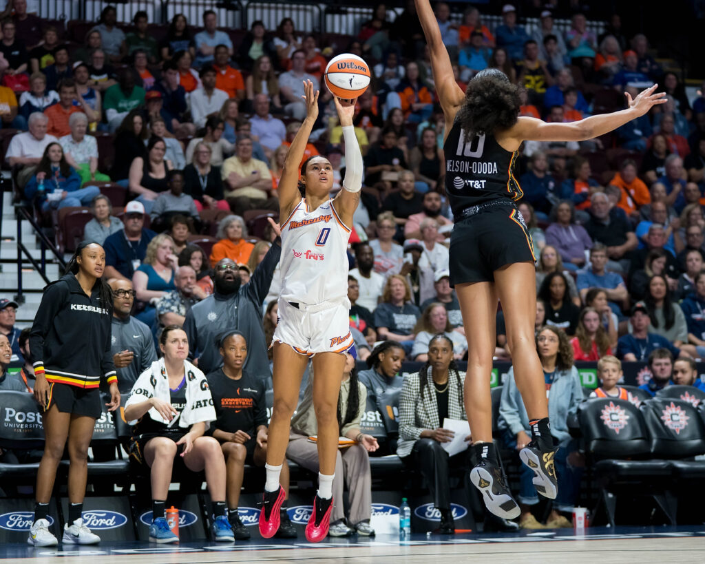 Phoenix Mercury forward Satou Sabally shoots a 3-pointer while Sun center <a rel=