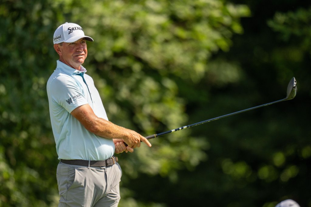 Lucas Glover tees off on the 13th hole during the first round of the John Deere Classic golf tournament.