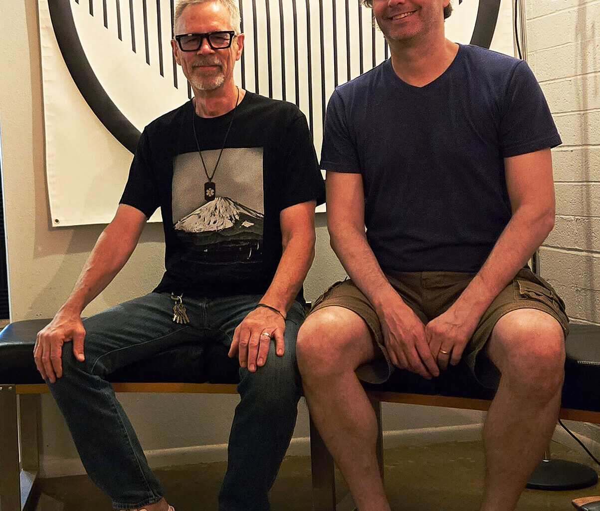 Fervor Records co-owners David Hilker, left, and Jeff Freundlich sit in the Fervor office on July 15 in the Sunnyslope neighborhood of North Phoenix.