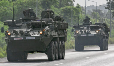 Royal Thai Army soldiers on armoured vehicles on a road in Chachoengsao province during a border row with Cambodia