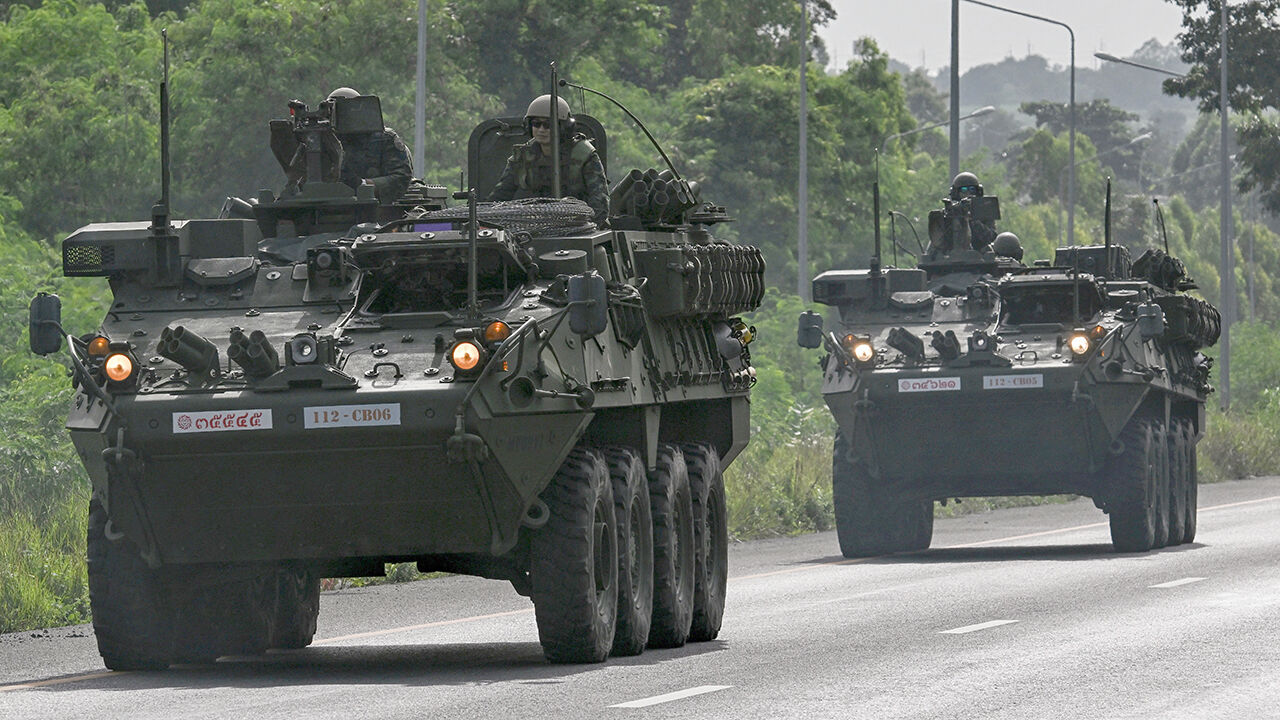 Royal Thai Army soldiers on armoured vehicles on a road in Chachoengsao province during a border row with Cambodia