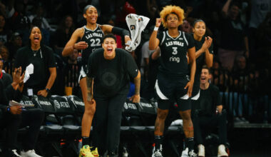 The Las Vegas Aces bench erupts as they gain momentum in the second half of a game between the ...