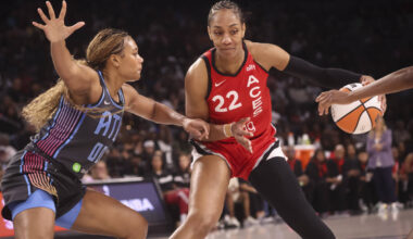 Aces center A'ja Wilson (22) drives the ball as Atlanta Dream forward Naz Hillmon (0) defends d ...