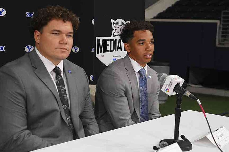 BYU running back LJ Martin, right, speaks as teammate defensive lineman Keanu Tanuvasa looks on during the Big 12 NCAA college football media days in Frisco, Texas, Tuesday, July 8, 2025. (AP Photo/LM Otero)