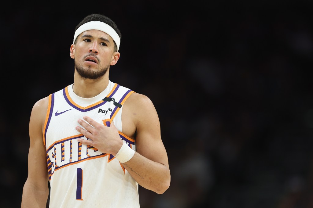 Devin Booker #1 of the Phoenix Suns reacts during the second half of the NBA game against the San Antonio Spurs at PHX Arena on April 11, 2025 in Phoenix, Arizona.