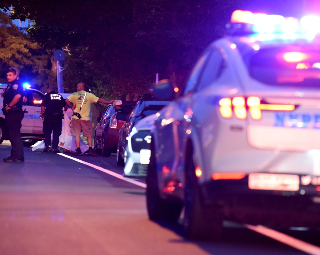 Police investigating a crime scene at night.