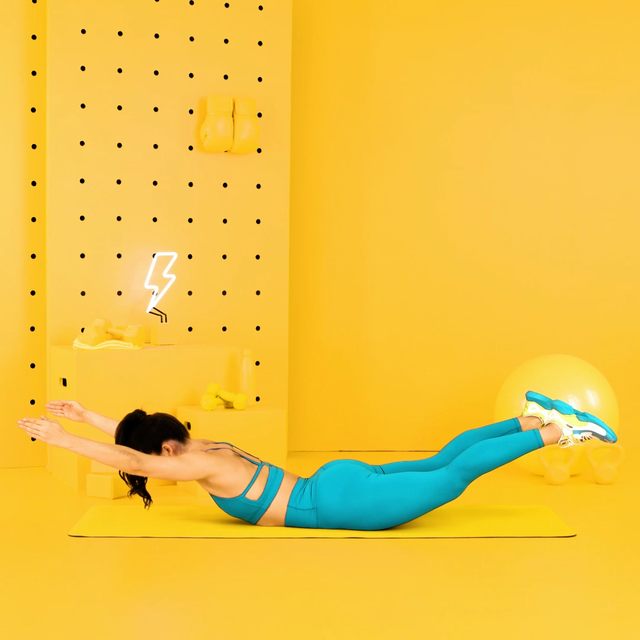 woman doing a superman workout