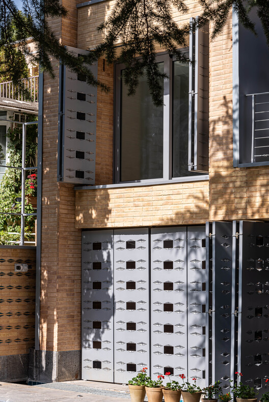 A House Looking to A Cedrus Tree / Cedrus Studio - Exterior Photography, Facade, Brick, Concrete, Balcony