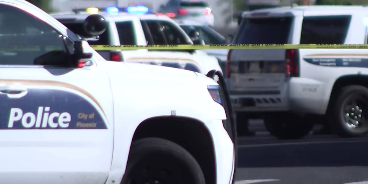 Standoff underway with armed suspect in busy west Phoenix parking lot