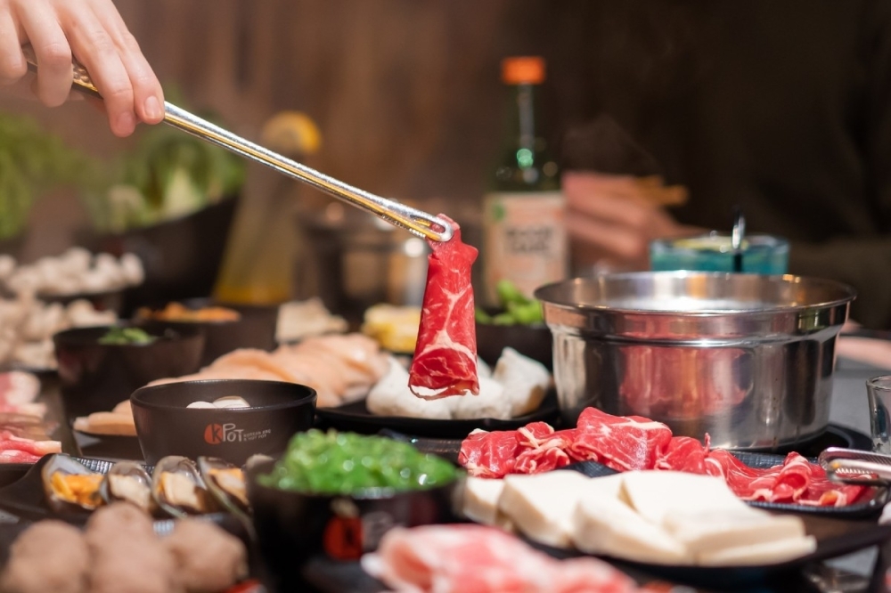 At KPot Korean BBQ & Hot Pot, indivduals use grills to cook ingredients before putting them into a pot of simmering soup stock. (Courtesy KPot Korean BBQ & Hot Pot)