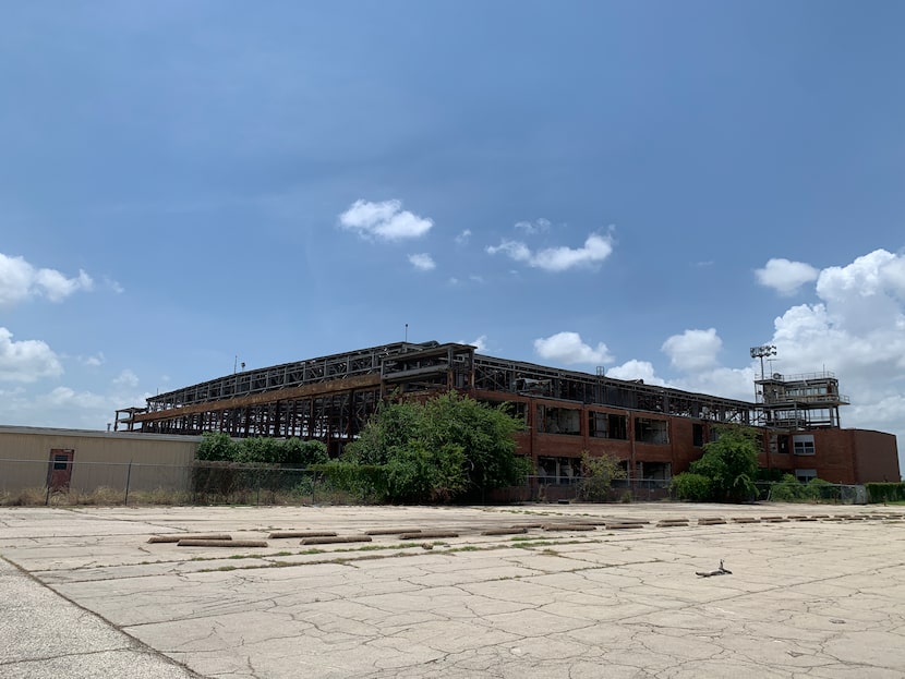 The maintenance hangar built in 1941 and abandoned in 1998 is among the massive structures...