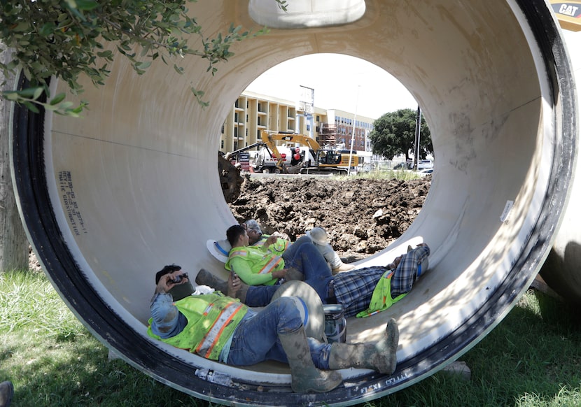 Thalle Construction Company workers Prudencio Guevara-Rangel (left), Oscar Perez, Alberto...