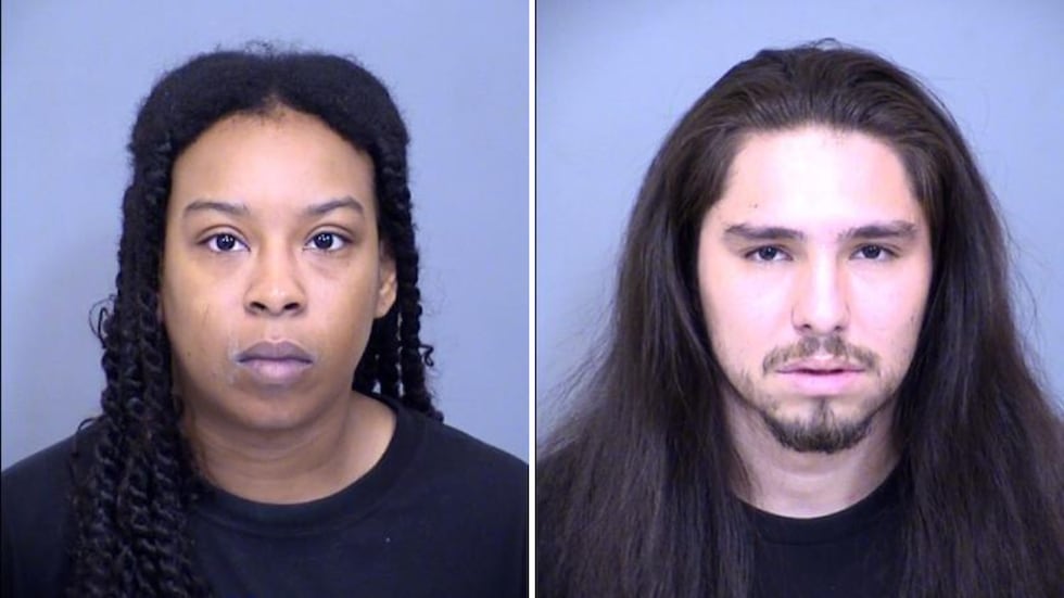 Ebony Johnson, left, and Telesfor Lavato, right, were booked into jail on four animal cruelty...