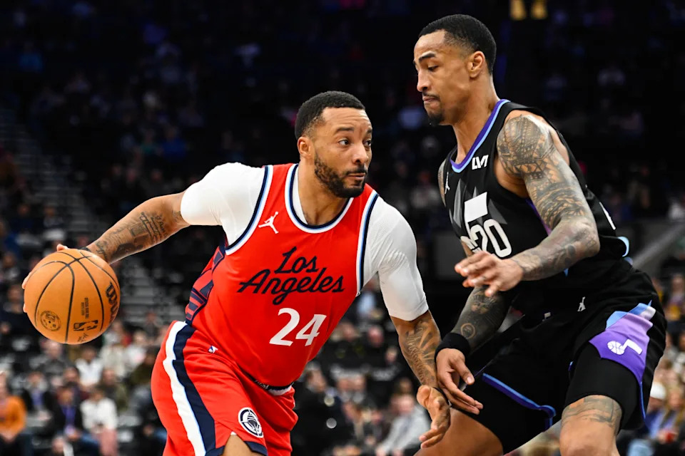 SALT LAKE CITY, UTAH - FEBRUARY 13: Norman Powell #24 of the LA Clippers drives into John Collins #20 of the Utah Jazz during the first half of a game at Delta Center on February 13, 2025 in Salt Lake City, Utah. NOTE TO USER: User expressly acknowledges and agrees that, by downloading and or using this photograph, User is consenting to the terms and conditions of the Getty Images License Agreement. (Photo by Alex Goodlett/Getty Images)