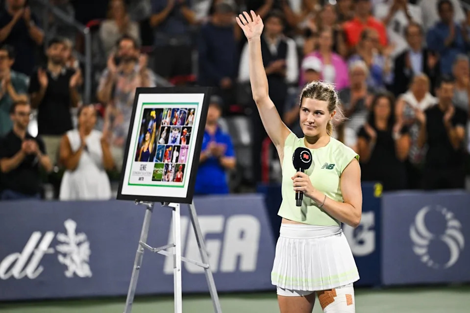 An emotional Eugenie Bouchard waves to the crowd during her retirement ceremony after she fell in the final singles match of her professional tennis career on July 30, 2025. David Kirouac-Imagn Images